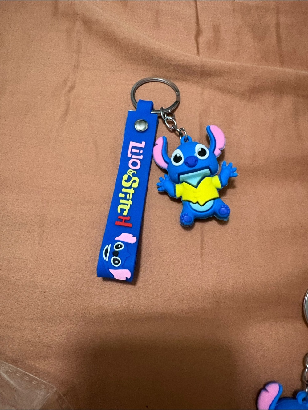 Blue Silicone Keychain with stitch on it